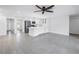 Spacious living area featuring neutral tones and a ceiling fan at 2146 Egret Drive, Clearwater, FL 33764