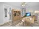 Bright office with hardwood flooring, built-in shelving, and a modern desk setup at 2146 Egret Drive, Clearwater, FL 33764