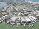 Aerial view of a waterfront neighborhood with homes, canals, and close proximity to the beach at 265 115Th Ave, Treasure Island, FL 33706