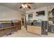 The bonus room includes a ceiling fan, closet, TV, and beige tile floors at 265 115Th Ave, Treasure Island, FL 33706