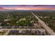 Aerial view showcases a community with lush landscaping and beautiful nearby views at 2693 Leafwing Ct, Palm Harbor, FL 34683