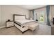Bedroom featuring a king bed, an adjacent balcony and neutral color palette at 2693 Leafwing Ct, Palm Harbor, FL 34683
