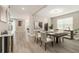 Bright dining room featuring modern decor and stylish furnishings at 2693 Leafwing Ct, Palm Harbor, FL 34683