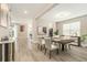 Dining room with wood table and stylish decor at 2693 Leafwing Ct, Palm Harbor, FL 34683