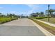 Community entrance features a brick-paved road leading to a secure gated entry at 2693 Leafwing Ct, Palm Harbor, FL 34683