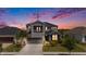 Charming two-story home featuring a balcony, a well-manicured lawn, and a two-car garage at 2693 Leafwing Ct, Palm Harbor, FL 34683