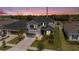 Beautiful two-story home with a balcony, a two-car garage, and manicured landscaping at 2693 Leafwing Ct, Palm Harbor, FL 34683