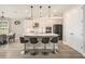 Modern kitchen with sleek white cabinets, stainless steel appliances, and an island with bar seating at 2693 Leafwing Ct, Palm Harbor, FL 34683