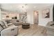 Open-concept floor plan with spacious living room and staircase leading to a modern kitchen at 2693 Leafwing Ct, Palm Harbor, FL 34683