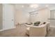 Stylish living area with neutral decor, comfortable seating, and ample space for relaxation at 2693 Leafwing Ct, Palm Harbor, FL 34683