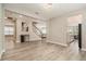 Open-concept living room showcasing the staircase, kitchen and other living areas at 2693 Leafwing Ct, Palm Harbor, FL 34683