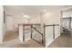 Upstairs loft overlooking a staircase with modern railings at 2693 Leafwing Ct, Palm Harbor, FL 34683