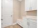 Functional mudroom featuring built-in bench, storage cabinets, and modern finishes at 2693 Leafwing Ct, Palm Harbor, FL 34683