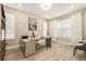 Comfortable home office with large desk, shelving, and ample natural light at 2693 Leafwing Ct, Palm Harbor, FL 34683