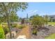 A close view of the community playground, featuring a variety of play structures and landscaping at 2693 Leafwing Ct, Palm Harbor, FL 34683
