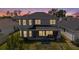Home's rear exterior showcasing a covered patio and spacious fenced backyard at 2693 Leafwing Ct, Palm Harbor, FL 34683