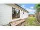 Backyard with a sliding glass door and wood deck at 2921 N 18Th St, Tampa, FL 33605