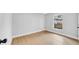 Bedroom featuring laminate flooring, neutral paint, and a window at 2921 N 18Th St, Tampa, FL 33605