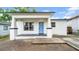 Charming single-story home featuring a welcoming front porch and light blue entry door at 2921 N 18Th St, Tampa, FL 33605