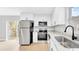Modern kitchen with stainless steel appliances, granite countertops and bright white cabinetry at 2921 N 18Th St, Tampa, FL 33605