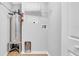 Laundry room features a water heater and shelving at 2921 N 18Th St, Tampa, FL 33605