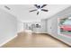 Open-concept living area featuring updated kitchen, light-colored walls, and wood-look floors at 2921 N 18Th St, Tampa, FL 33605