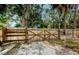 Wood fence, offering both privacy and curb appeal at 306 Banana St, Tarpon Springs, FL 34689