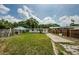 Well-maintained backyard with lush lawn, perfect for outdoor entertaining at 306 Banana St, Tarpon Springs, FL 34689