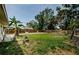 Expansive backyard with mature trees, offering shade and privacy at 306 Banana St, Tarpon Springs, FL 34689