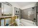 Renovated bathroom featuring a tiled shower and modern fixtures at 306 Banana St, Tarpon Springs, FL 34689