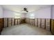 Bright bedroom with tile floors, windows, and a modern ceiling fan at 306 Banana St, Tarpon Springs, FL 34689