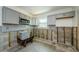 Updated kitchen with sleek gray cabinets and stylish subway tile backsplash at 306 Banana St, Tarpon Springs, FL 34689