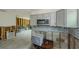 Open kitchen area boasts stainless steel appliances and ample natural light at 306 Banana St, Tarpon Springs, FL 34689