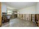 Unfinished kitchen area with concrete flooring, neutral cabinets, and exposed framework for renovation at 306 Banana St, Tarpon Springs, FL 34689