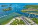 Stunning aerial view showcasing the marina, boats, and pristine turquoise waters surrounding the property at 3072 Inlet Breeze Way, Holiday, FL 34691