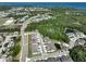 Aerial view shows a well-maintained community near water and green spaces at 3072 Inlet Breeze Way, Holiday, FL 34691