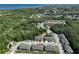 Aerial view of community, showcasing nearby greenery, and proximity to the water at 3072 Inlet Breeze Way, Holiday, FL 34691