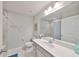 Bathroom with a large vanity, toilet, and combination shower and bathtub at 3072 Inlet Breeze Way, Holiday, FL 34691