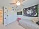 Bedroom featuring a ceiling fan, closet, and window for natural light at 3072 Inlet Breeze Way, Holiday, FL 34691