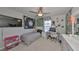 Bedroom featuring a ceiling fan, large window, and desk space for studying at 3072 Inlet Breeze Way, Holiday, FL 34691