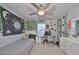 Bedroom featuring a ceiling fan, large window, and desk space for studying at 3072 Inlet Breeze Way, Holiday, FL 34691