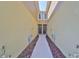 Inviting entrance to attached townhomes, walkway adorned with mulch landscaping at 3072 Inlet Breeze Way, Holiday, FL 34691