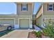 Charming townhome featuring a one-car garage and manicured landscaping at 3072 Inlet Breeze Way, Holiday, FL 34691