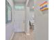 Bright foyer with modern decor and a view of the adjacent dining area at 3072 Inlet Breeze Way, Holiday, FL 34691