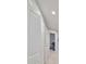 Bright hallway with white trim, neutral walls, and a glimpse into a bedroom at 3072 Inlet Breeze Way, Holiday, FL 34691