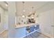 Stylish kitchen with a breakfast bar, granite countertops, and stainless steel appliances at 3072 Inlet Breeze Way, Holiday, FL 34691