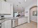 Well-equipped kitchen with granite countertops, stainless steel appliances, and open floor plan at 3072 Inlet Breeze Way, Holiday, FL 34691