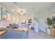 Inviting living room with sleek gray sofas and open floor plan to the kitchen, perfect for entertaining at 3072 Inlet Breeze Way, Holiday, FL 34691