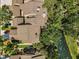 Aerial view highlighting rooftops and dense, mature trees surrounding homes in a tranquil community at 3079 Landmark Blvd # 1608, Palm Harbor, FL 34684