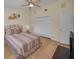 Comfortable bedroom featuring a ceiling fan, closet, and bright natural light at 3079 Landmark Blvd # 1608, Palm Harbor, FL 34684